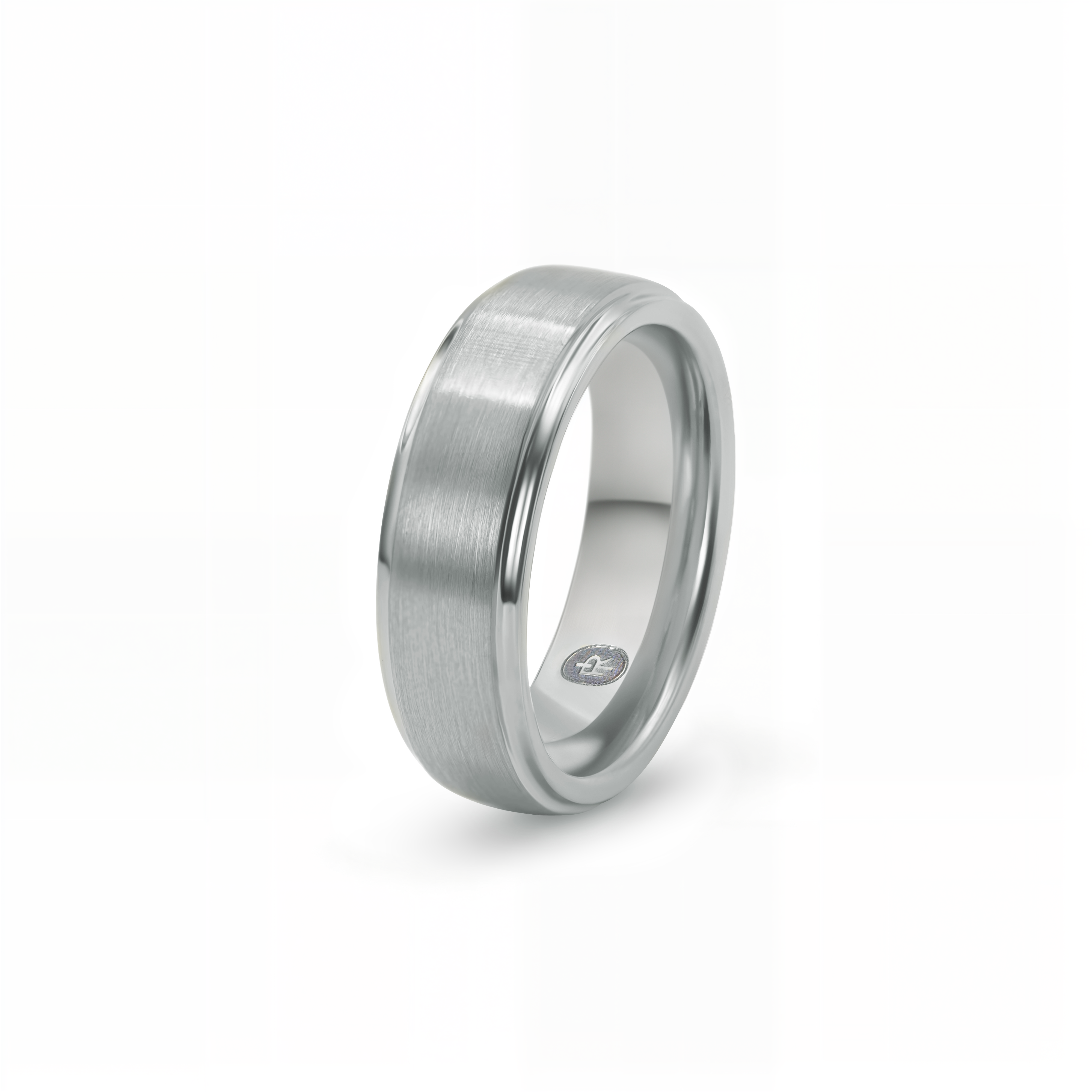 "The Gentleman" tungsten ring in brushed silver, photographed from the side showing the Iconic Rings engraved logo