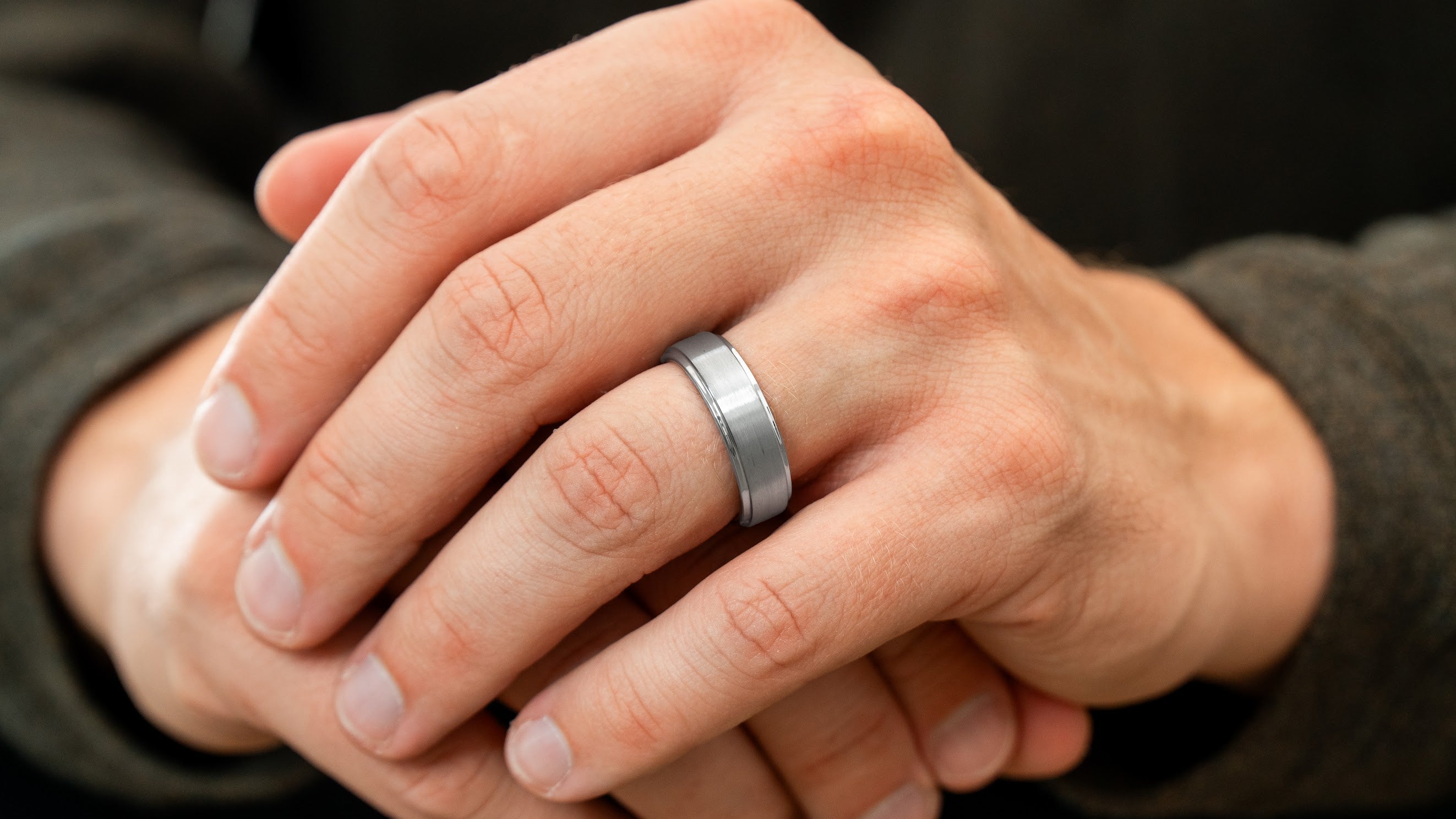 Macro close-up of The Gentleman brushed silver tungsten ring showing its finish and comfort-fit profile